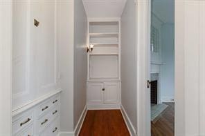 corridor featuring dark wood-type flooring