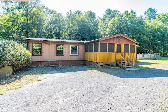 view of front of house featuring a swimming pool