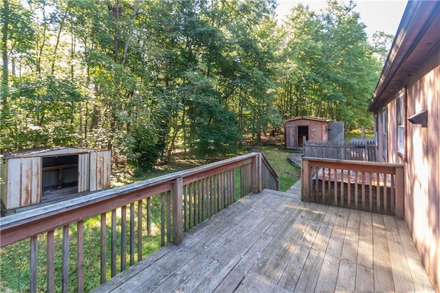 wooden deck featuring a shed