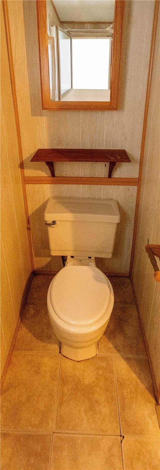 bathroom featuring tile patterned flooring and toilet