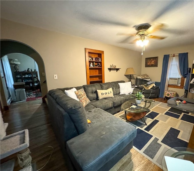 living room with ceiling fan and wood-type flooring