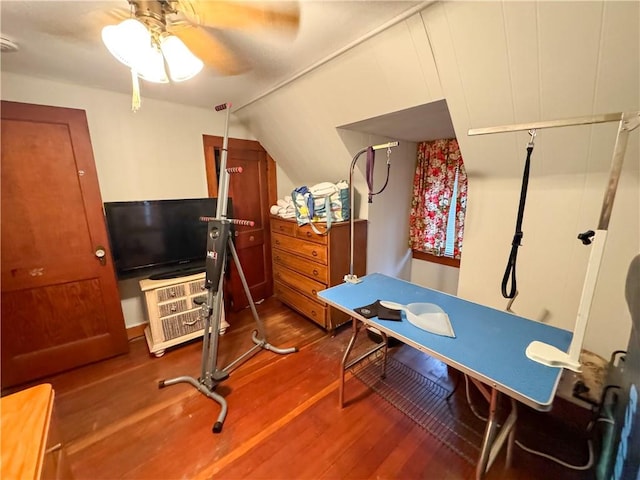 office featuring hardwood / wood-style floors, ceiling fan, and vaulted ceiling