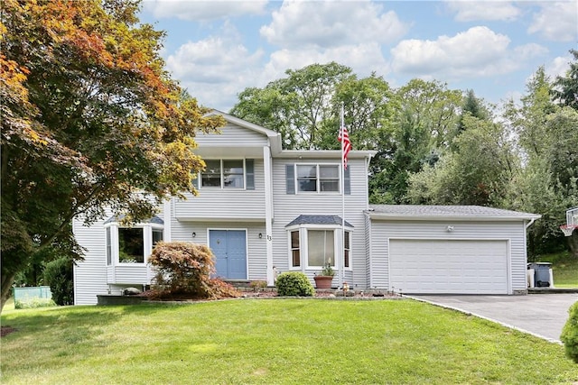 view of front of house featuring a garage and a front yard