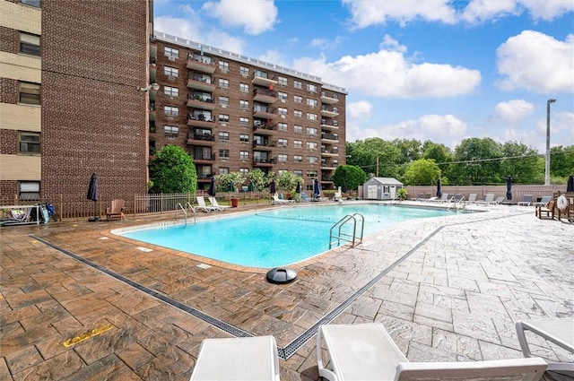 view of swimming pool featuring a patio