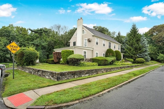 view of home's exterior with a yard