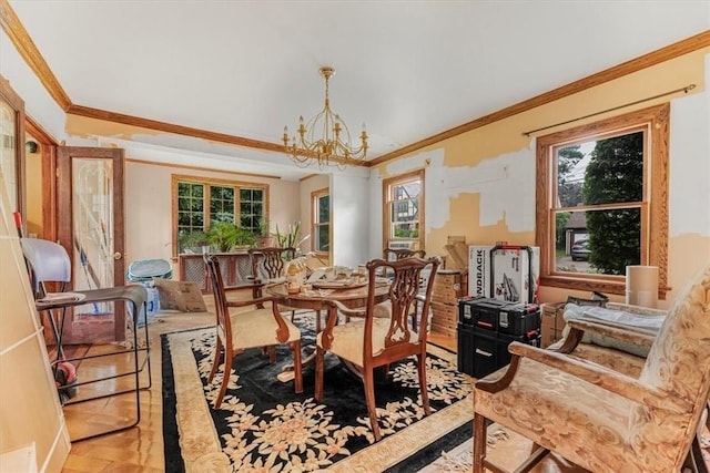 dining area featuring a notable chandelier and crown molding