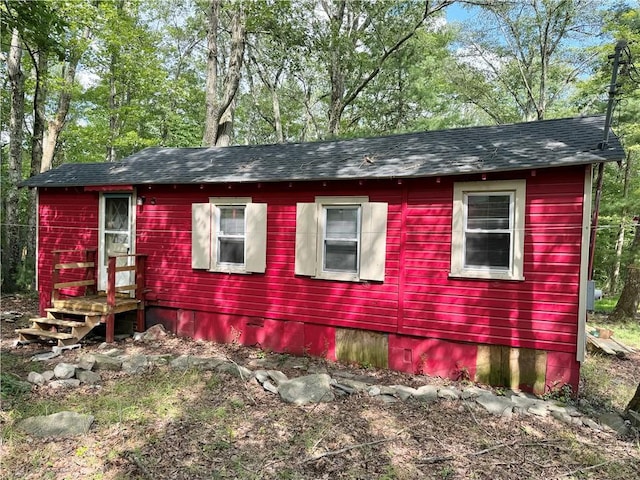 view of home's exterior featuring a shingled roof