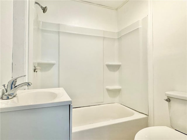 bathroom featuring toilet, bathtub / shower combination, and vanity