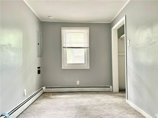 unfurnished bedroom featuring carpet, ornamental molding, a baseboard radiator, and baseboards