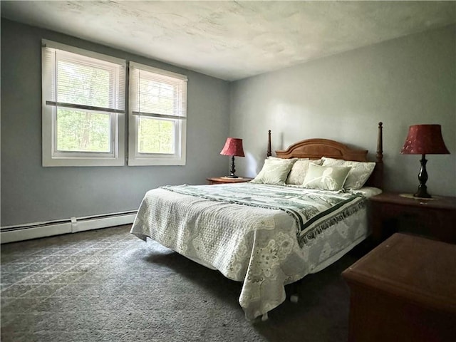carpeted bedroom featuring a baseboard radiator