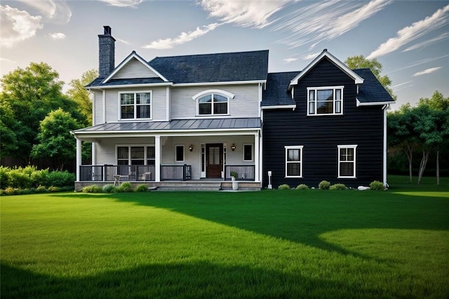 view of front facade featuring covered porch and a front yard