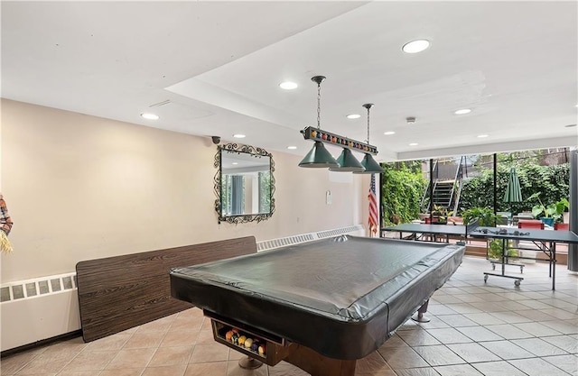 playroom with light tile patterned floors, radiator, and pool table