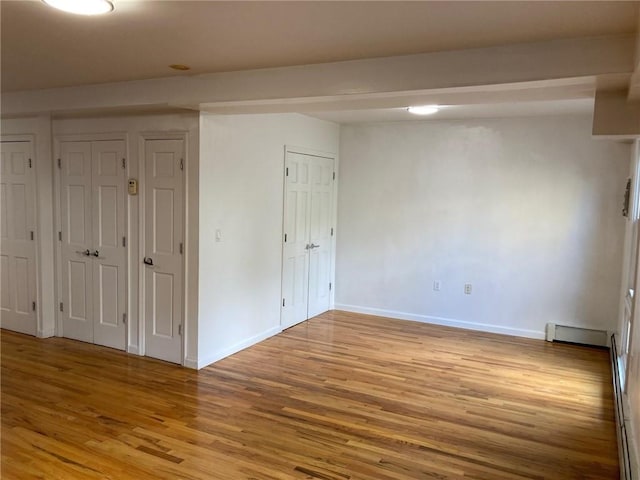 spare room featuring light hardwood / wood-style flooring