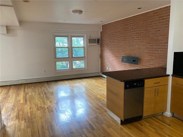 kitchen featuring a wall mounted air conditioner, light wood-type flooring, stainless steel dishwasher, and baseboard heating