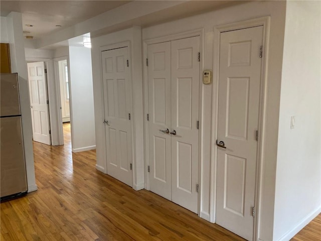 corridor featuring light hardwood / wood-style floors