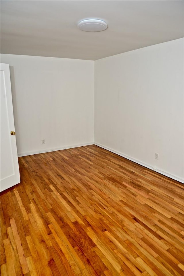 spare room featuring light hardwood / wood-style floors