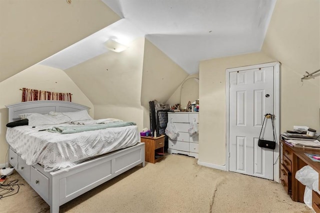 carpeted bedroom featuring vaulted ceiling