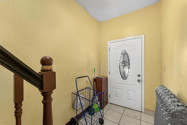 entryway featuring light tile patterned floors