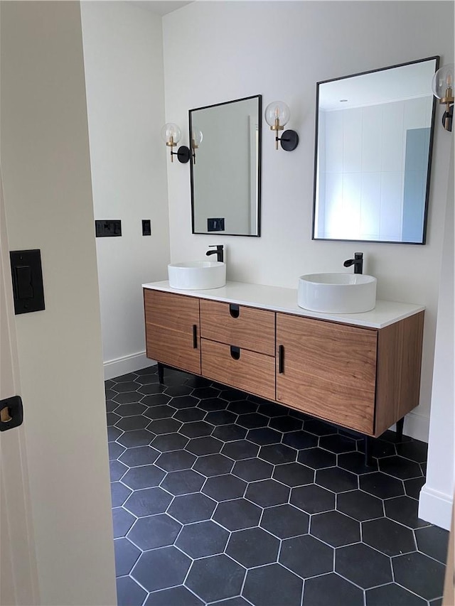 bathroom with tile patterned flooring and vanity