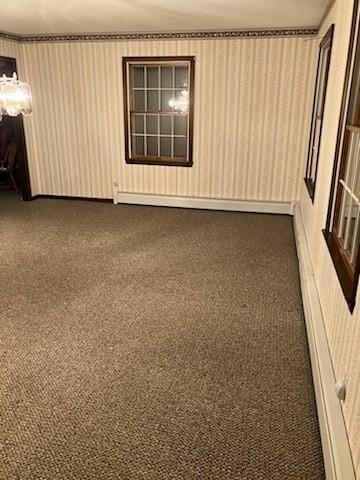 empty room featuring dark colored carpet