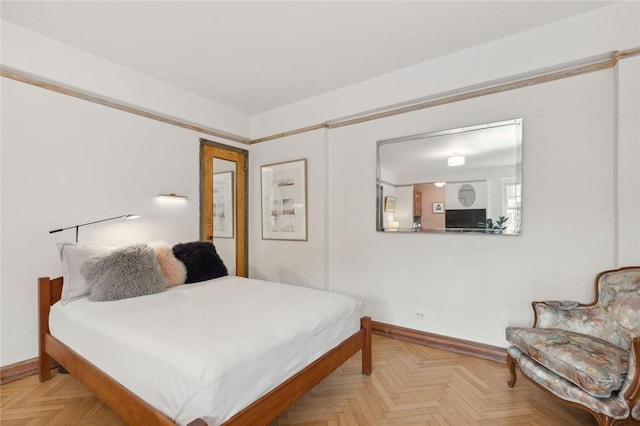 bedroom featuring light parquet floors