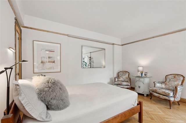 bedroom with light parquet floors