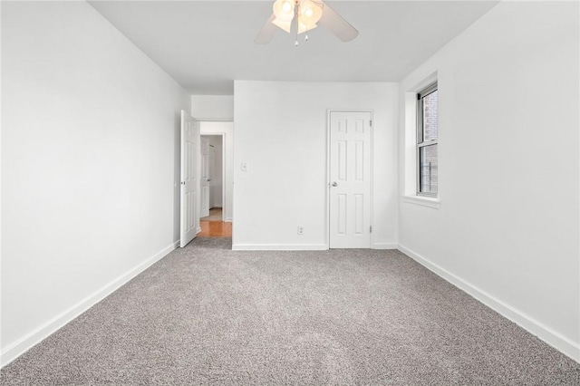 unfurnished bedroom featuring carpet, ceiling fan, and a closet