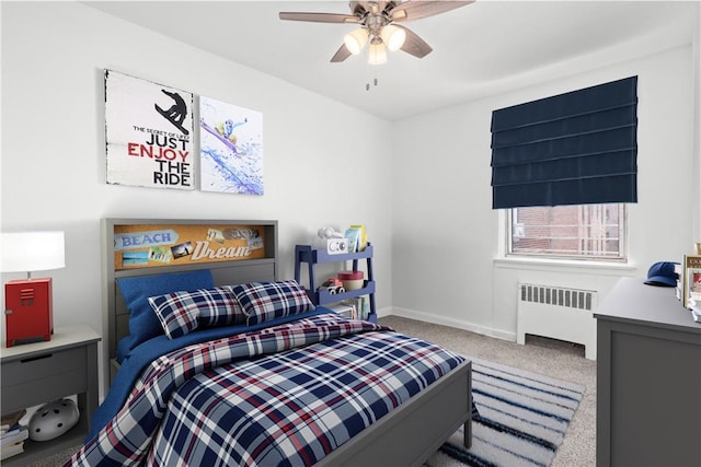 bedroom with carpet floors, radiator, and ceiling fan