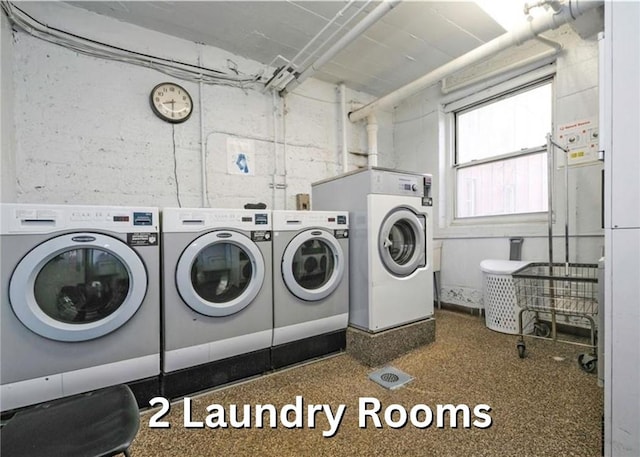 clothes washing area with independent washer and dryer