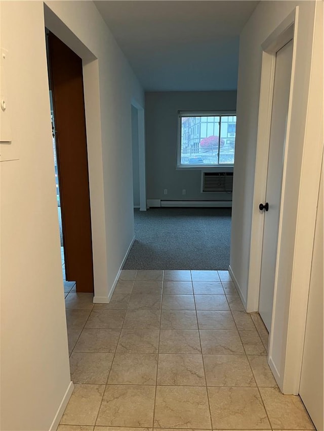 hall with tile walls and beamed ceiling