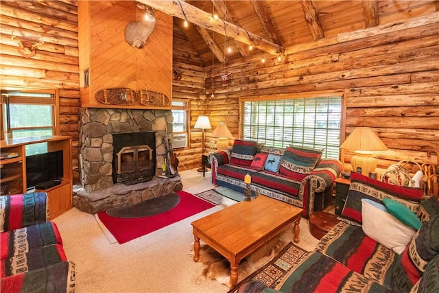 living room featuring beam ceiling, rustic walls, and plenty of natural light