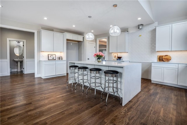 kitchen with white cabinets and dark hardwood / wood-style floors