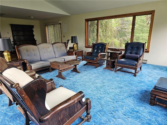 living room with carpet and vaulted ceiling