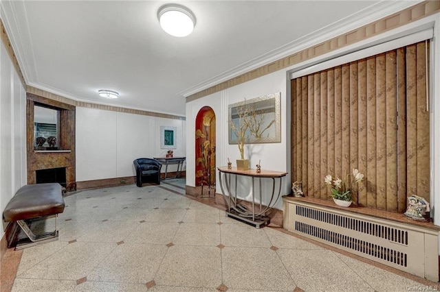 hall featuring radiator and crown molding