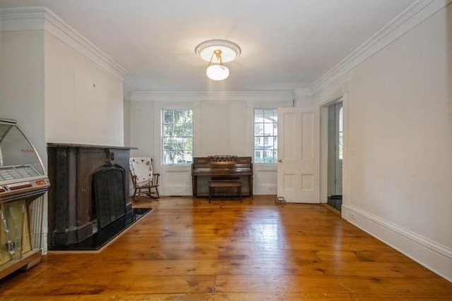 living room with hardwood / wood-style floors and crown molding