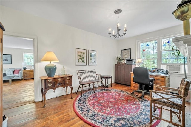 office featuring hardwood / wood-style flooring and a chandelier