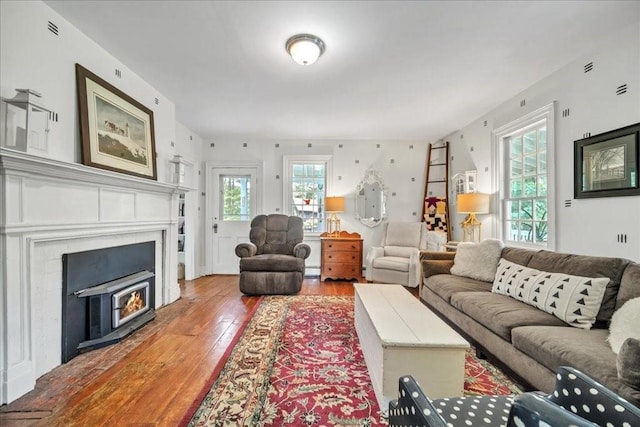 living room featuring wood-type flooring and plenty of natural light