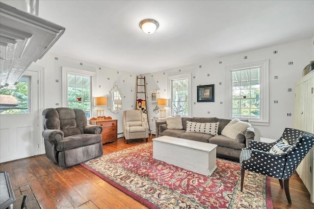 living room with hardwood / wood-style flooring and baseboard heating