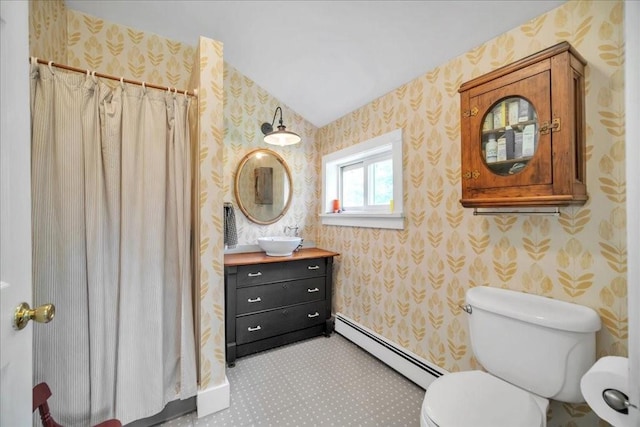 bathroom with a shower with shower curtain, vanity, toilet, and a baseboard heating unit