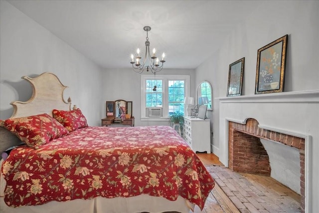 bedroom featuring cooling unit, light wood-type flooring, and a notable chandelier