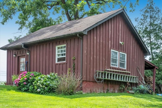 view of home's exterior with a lawn