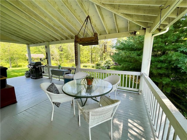 wooden deck with a grill