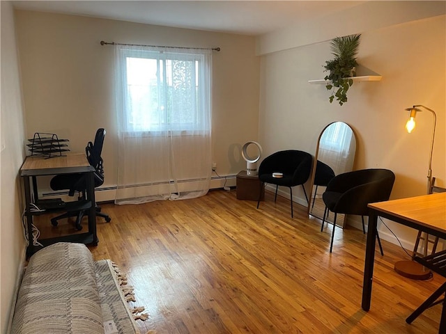 office area with light hardwood / wood-style floors