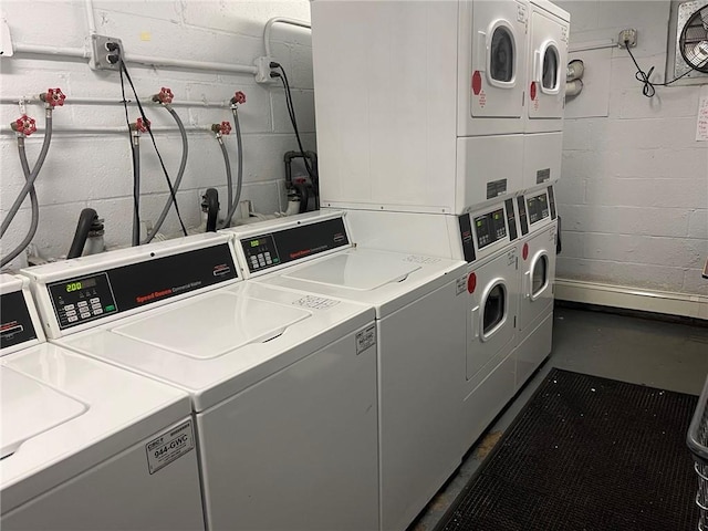 washroom featuring washer and dryer and stacked washer / drying machine