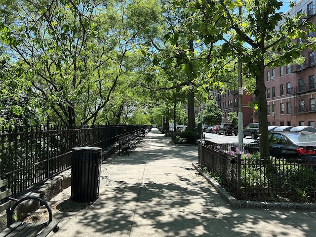 view of community featuring fence