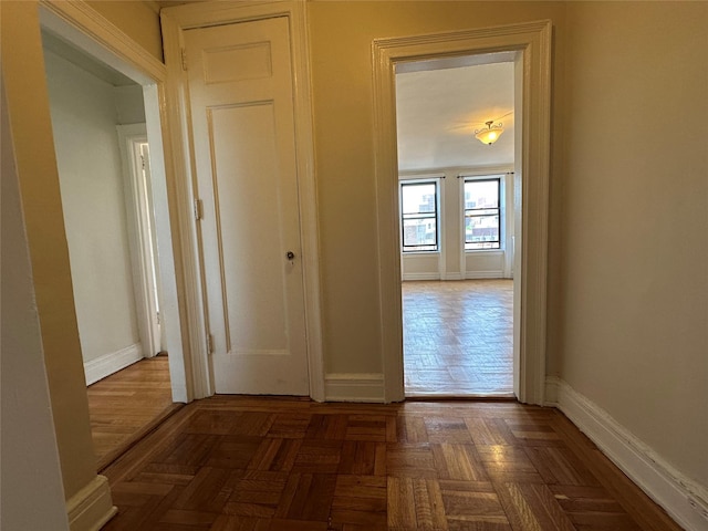 corridor featuring baseboards