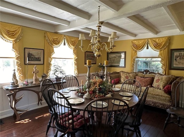 dining space featuring beam ceiling, dark hardwood / wood-style flooring, and an inviting chandelier