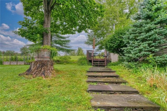 view of yard featuring a wooden deck