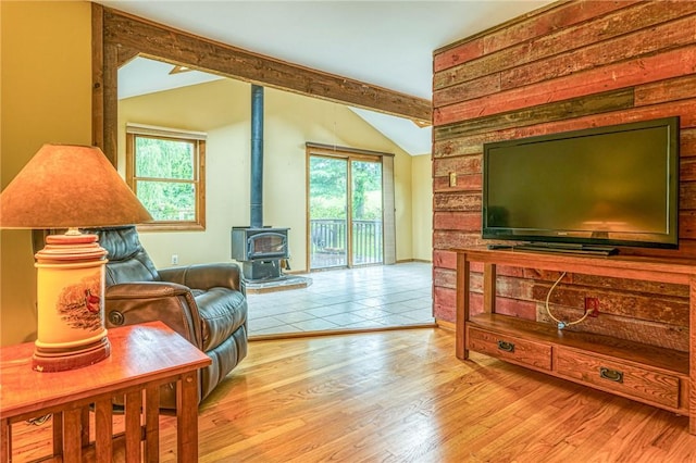 sitting room featuring plenty of natural light, light hardwood / wood-style floors, and lofted ceiling