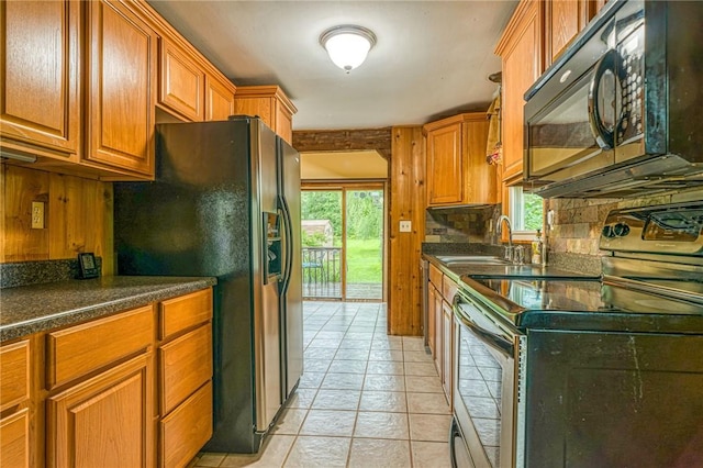 kitchen with tasteful backsplash, sink, and black appliances